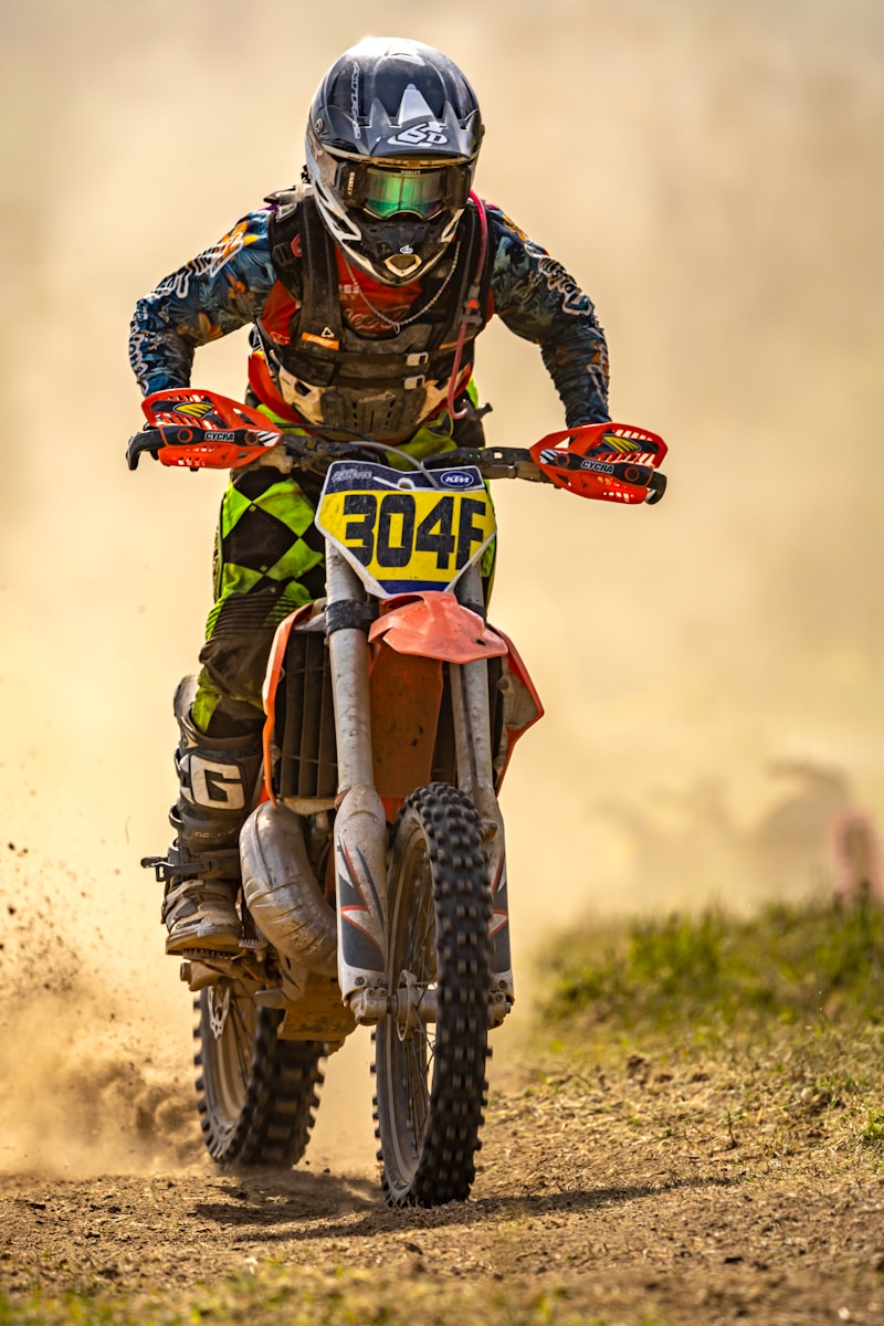 a man riding a dirt bike with motorcycle coverage